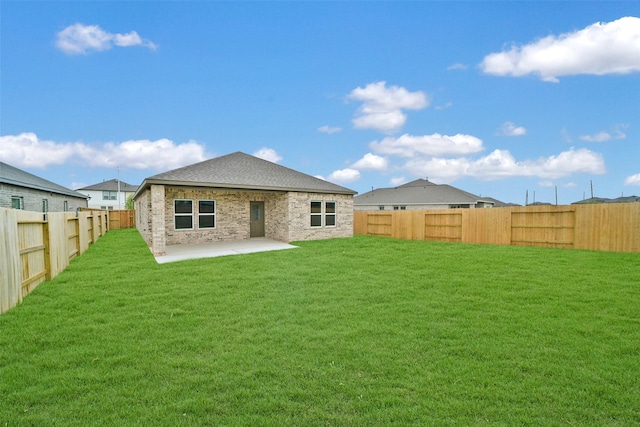 2556 Newport Breeze Dr, Katy, TX 77493 - back of property featuring a patio area, a fenced backyard, and roof with shingles