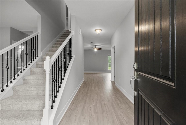 5000 Boreas Dr, Alvin, TX 77511 - foyer featuring ceiling fan, light wood-type flooring, and stairs