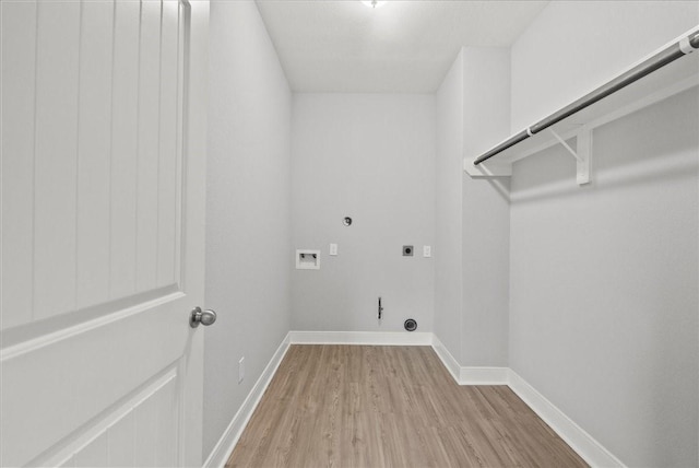 5000 Boreas Dr, Alvin, TX 77511 - laundry area with hookup for a gas dryer, hookup for an electric dryer, light wood-type flooring, and hookup for a washing machine