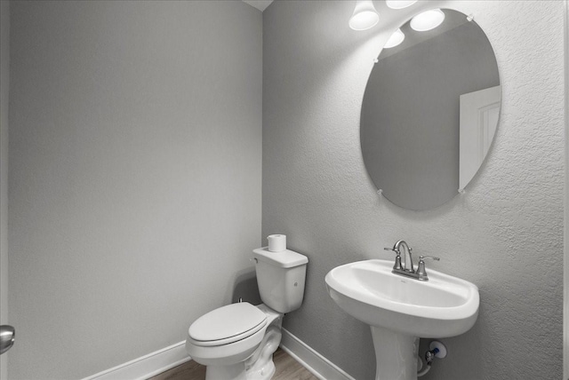 5000 Boreas Dr, Alvin, TX 77511 - bathroom featuring wood finished floors and toilet