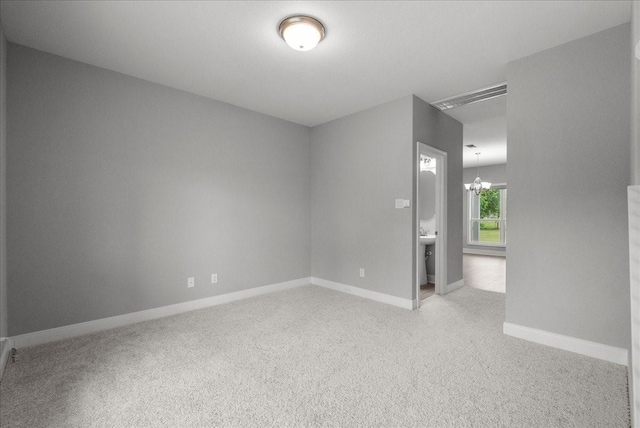 5000 Boreas Dr, Alvin, TX 77511 - spare room with light colored carpet and a chandelier