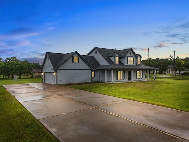 5000 Boreas Dr, Alvin, TX 77511 - view of front of property featuring covered porch, board and batten siding, a garage, driveway, and a yard