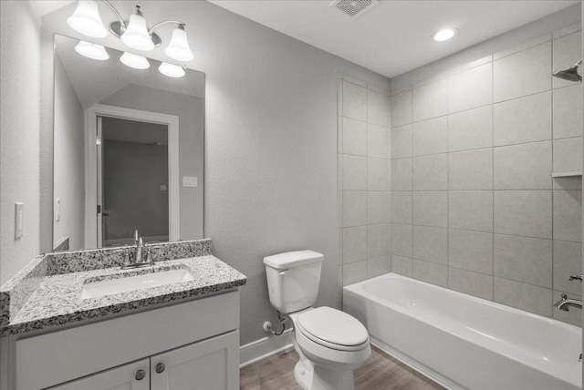5000 Boreas Dr, Alvin, TX 77511 - full bathroom with wood finished floors, vanity,  shower combination, and recessed lighting