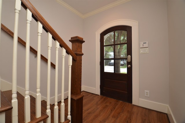 1605 Cohn St, Houston, TX 77007 - entryway with dark wood finished floors, crown molding, arched walkways, and stairway