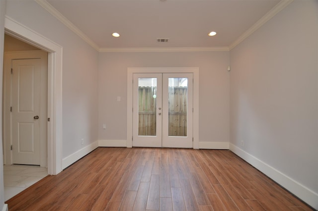 1605 Cohn St, Houston, TX 77007 - empty room featuring french doors, wood finished floors, ornamental molding, and recessed lighting