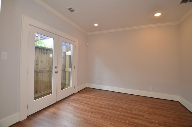 1605 Cohn St, Houston, TX 77007 - unfurnished room featuring french doors, wood finished floors, ornamental molding, and recessed lighting