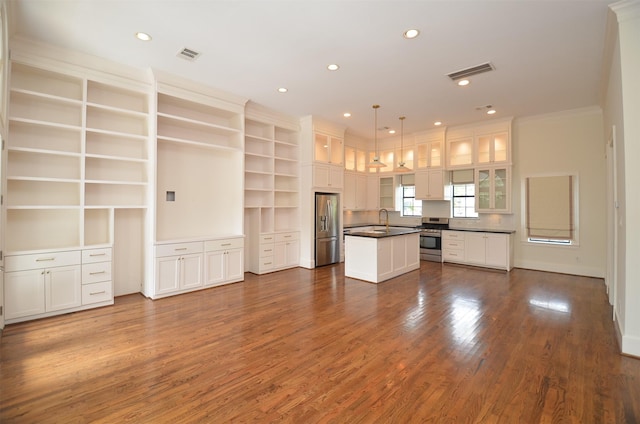 1605 Cohn St, Houston, TX 77007 - unfurnished living room with dark wood-type flooring, crown molding, and recessed lighting