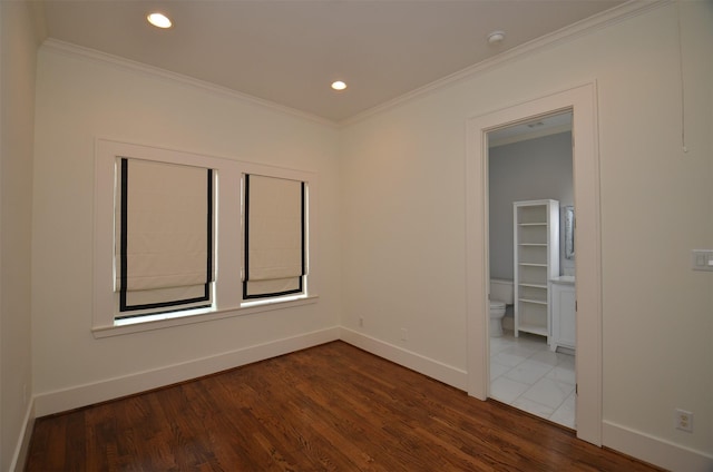 1605 Cohn St, Houston, TX 77007 - unfurnished room featuring dark wood finished floors, ornamental molding, recessed lighting, and a smoke detector