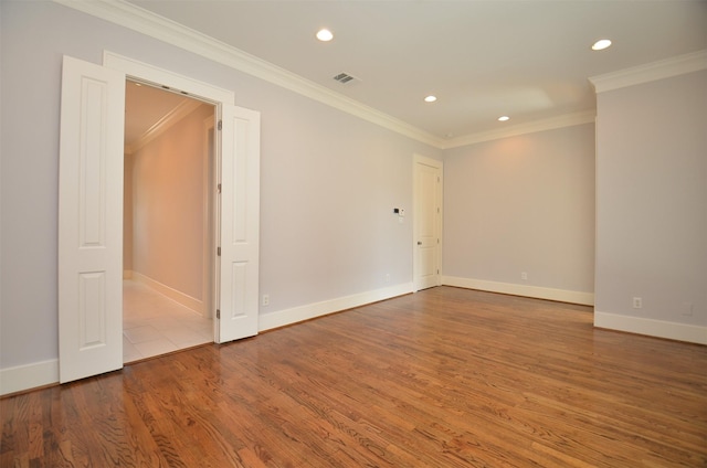 1605 Cohn St, Houston, TX 77007 - spare room with recessed lighting, crown molding, and wood finished floors