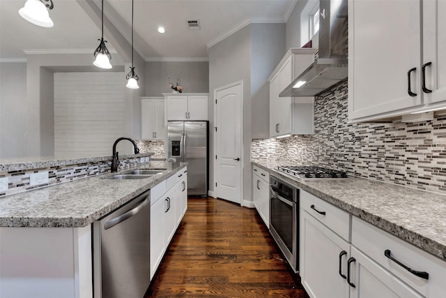 1025 W 21st St Unit C, Houston, TX 77008 - kitchen featuring stainless steel appliances, wall chimney exhaust hood, crown molding, decorative backsplash, and white cabinetry