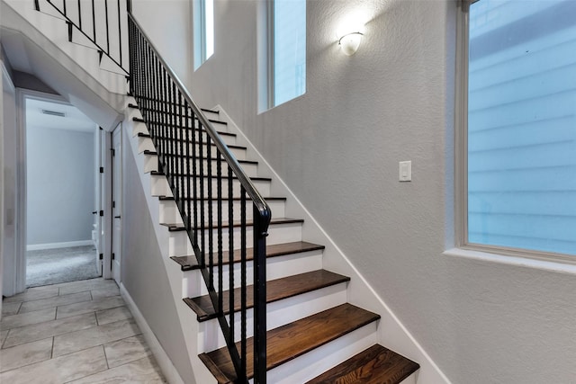 1025 W 21st St Unit C, Houston, TX 77008 - stairway featuring tile patterned flooring and a textured wall
