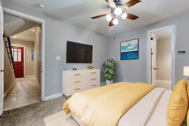 1025 W 21st St Unit C, Houston, TX 77008 - bedroom with a ceiling fan, light carpet, and light tile patterned floors