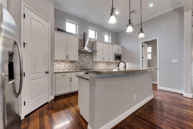 1025 W 21st St Unit C, Houston, TX 77008 - kitchen with appliances with stainless steel finishes, wall chimney range hood, ornamental molding, backsplash, and dark wood-type flooring