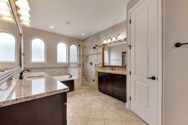 1025 W 21st St Unit C, Houston, TX 77008 - bathroom featuring two vanities, a bath, tiled shower, tile patterned flooring, and recessed lighting