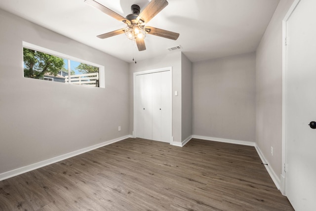 116 Harbour Ln, Coldspring, TX 77331 - unfurnished bedroom featuring wood finished floors, a closet, and ceiling fan