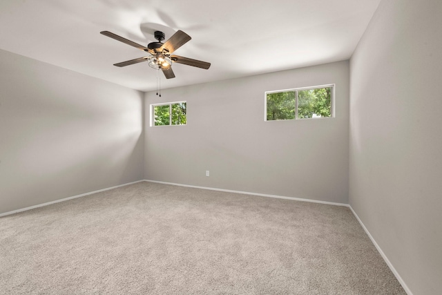 116 Harbour Ln, Coldspring, TX 77331 - empty room with carpet floors and a ceiling fan