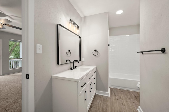 116 Harbour Ln, Coldspring, TX 77331 - full bath featuring vanity, a ceiling fan, wood finished floors, and tub / shower combination