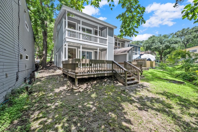 116 Harbour Ln, Coldspring, TX 77331 - rear view of property featuring a wooden deck and a sunroom