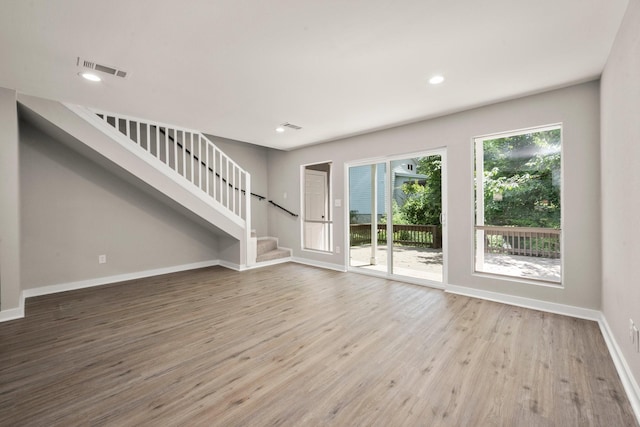 116 Harbour Ln, Coldspring, TX 77331 - unfurnished living room with stairs, wood finished floors, and recessed lighting