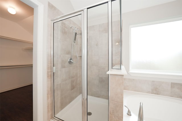 10166 Hidden Creek Falls Ln, Brookshire, TX 77423 - bathroom with a walk in closet, a shower stall, and a bath