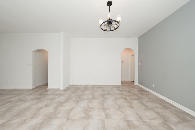 10166 Hidden Creek Falls Ln, Brookshire, TX 77423 - empty room featuring arched walkways and a chandelier