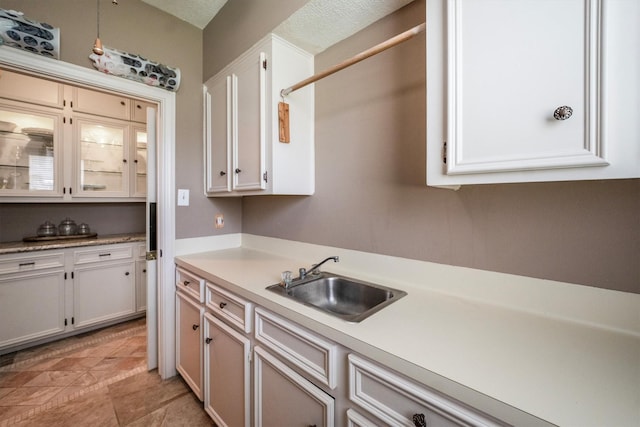 17603 Hidden Forest Dr, Spring, TX 77379 - kitchen featuring light countertops and white cabinets