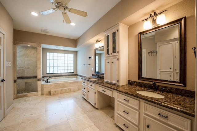 17603 Hidden Forest Dr, Spring, TX 77379 - full bathroom featuring double vanity, a bath, a shower stall, a ceiling fan, and recessed lighting