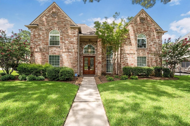17603 Hidden Forest Dr, Spring, TX 77379 - traditional-style house with french doors and brick siding