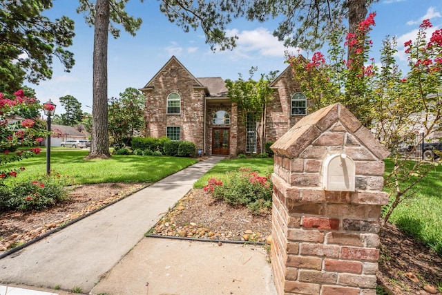 17603 Hidden Forest Dr, Spring, TX 77379 - view of front of home with a front lawn and brick siding