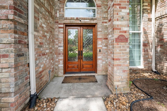 17603 Hidden Forest Dr, Spring, TX 77379 - doorway to property featuring french doors and brick siding
