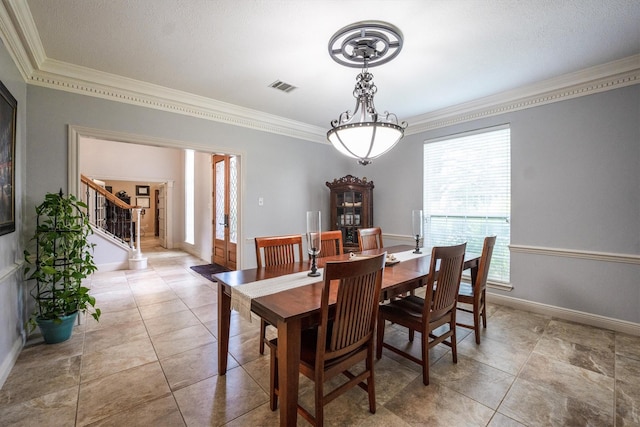 17603 Hidden Forest Dr, Spring, TX 77379 - tiled dining space with ornamental molding and stairs