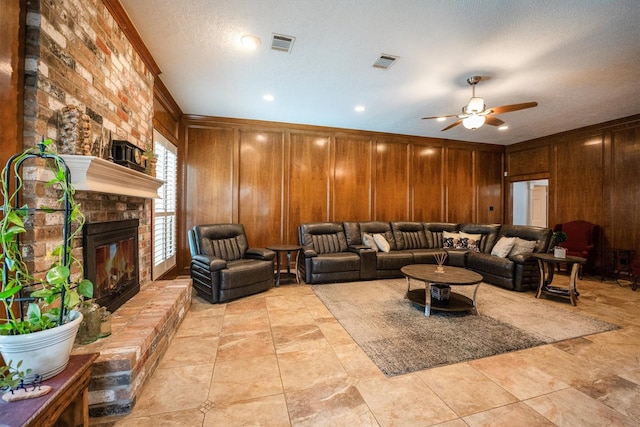 17603 Hidden Forest Dr, Spring, TX 77379 - living area featuring wooden walls, a fireplace, and a ceiling fan