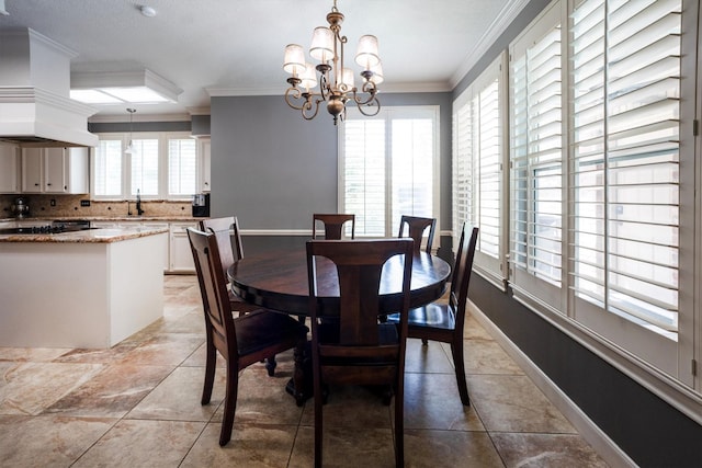 17603 Hidden Forest Dr, Spring, TX 77379 - dining area featuring ornamental molding, a chandelier, and light tile patterned floors