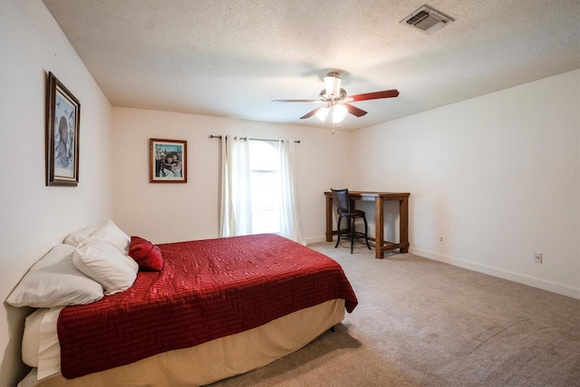 17603 Hidden Forest Dr, Spring, TX 77379 - bedroom featuring carpet flooring, a ceiling fan, and a textured ceiling