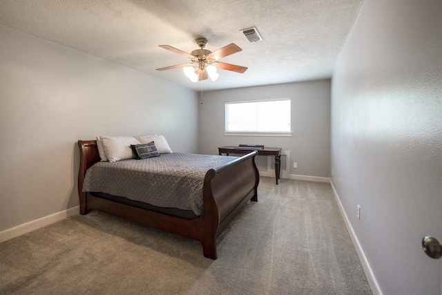 17603 Hidden Forest Dr, Spring, TX 77379 - bedroom with light carpet, a ceiling fan, and a textured ceiling