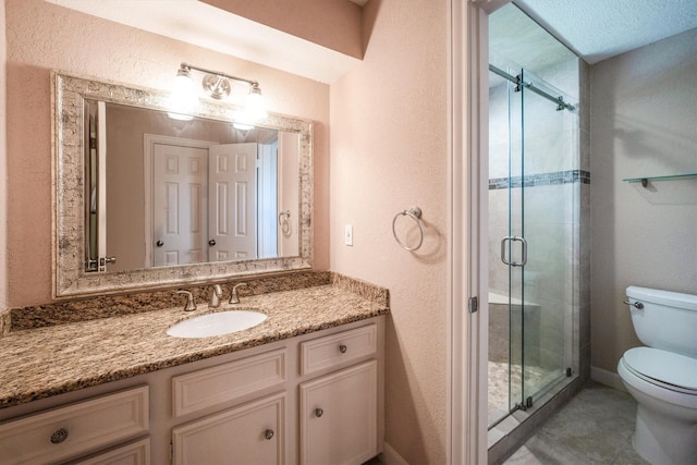 17603 Hidden Forest Dr, Spring, TX 77379 - full bathroom featuring vanity, a stall shower, tile patterned floors, and a textured wall