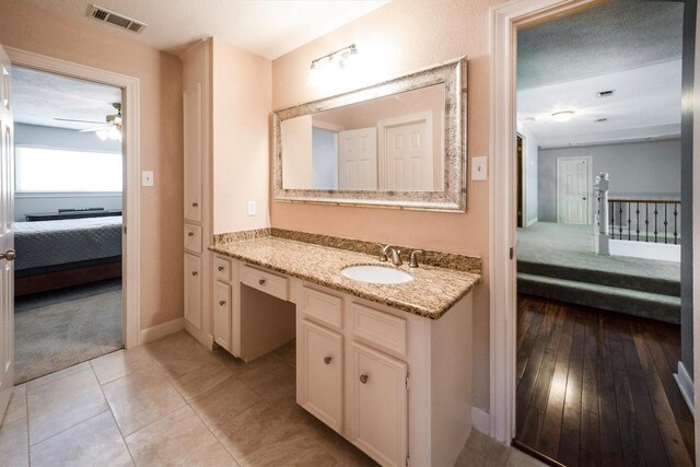 17603 Hidden Forest Dr, Spring, TX 77379 - ensuite bathroom with vanity, ceiling fan, and tile patterned flooring