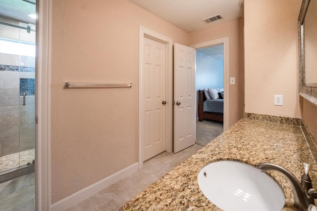 17603 Hidden Forest Dr, Spring, TX 77379 - full bath featuring a shower stall, vanity, tile patterned flooring, and ensuite bath