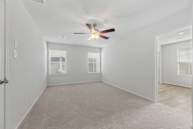 5263 Shallowhurst Ln, Katy, TX 77449 - empty room with light carpet and ceiling fan