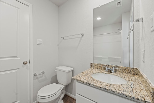 5263 Shallowhurst Ln, Katy, TX 77449 - bathroom featuring vanity, a shower, and wood finished floors