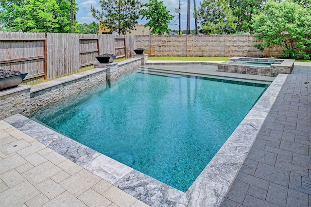 3854 Fleetwood Falls Ln, Spring, TX 77386 - view of swimming pool with an in-ground hot tub, a fenced backyard, and a patio