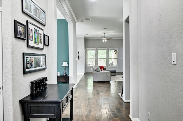 3854 Fleetwood Falls Ln, Spring, TX 77386 - hallway with dark wood-type flooring, ornamental molding, and a textured wall