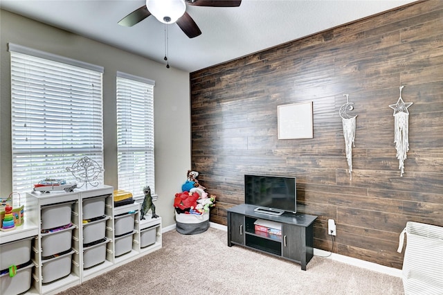 3854 Fleetwood Falls Ln, Spring, TX 77386 - carpeted living area with ceiling fan and wooden walls