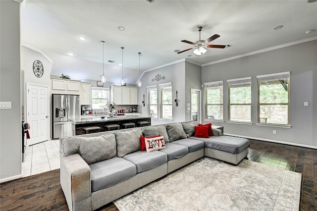 3854 Fleetwood Falls Ln, Spring, TX 77386 - living room featuring dark wood finished floors, ceiling fan, ornamental molding, and recessed lighting