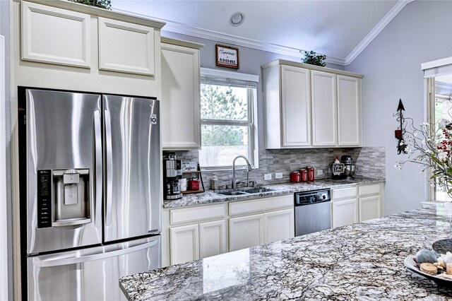 3854 Fleetwood Falls Ln, Spring, TX 77386 - kitchen with stainless steel appliances, crown molding, decorative backsplash, and healthy amount of natural light