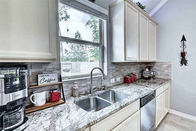 3854 Fleetwood Falls Ln, Spring, TX 77386 - kitchen with stainless steel dishwasher, decorative backsplash, light stone counters, white cabinetry, and ornamental molding