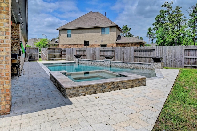 3854 Fleetwood Falls Ln, Spring, TX 77386 - view of pool featuring an in-ground hot tub, a patio, and a fenced backyard