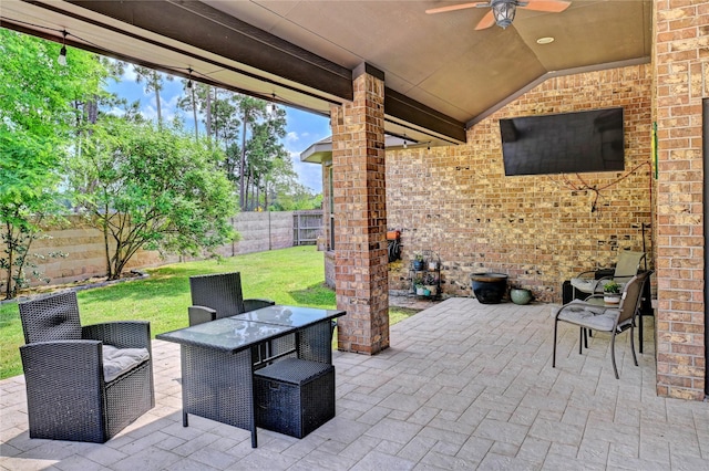 3854 Fleetwood Falls Ln, Spring, TX 77386 - fenced backyard featuring ceiling fan, a patio, and outdoor dining area