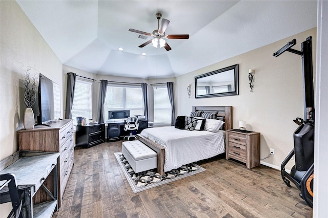 3854 Fleetwood Falls Ln, Spring, TX 77386 - bedroom featuring wood finished floors, a tray ceiling, a desk, a ceiling fan, and lofted ceiling