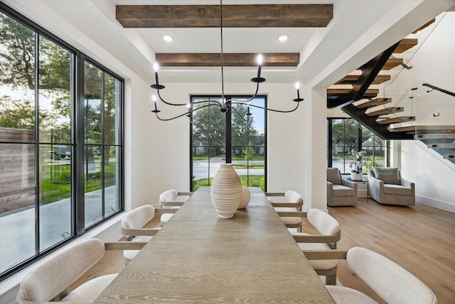 431 W 30th St, Houston, TX 77018 - dining area featuring wood finished floors, stairway, beamed ceiling, and plenty of natural light